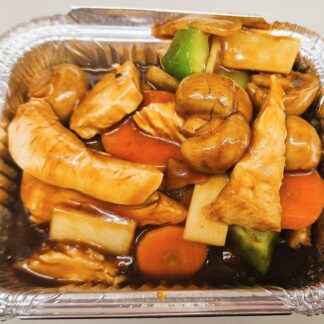 Stir-fried chicken with mixed vegetables including mushrooms, green peppers, and carrots